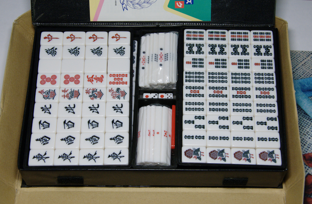 Japanese mahjong set in case — tiles plus dice and scoring sticks as a complete commercial kit