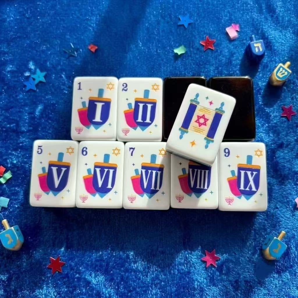 Festival Celebration bams — dreidels with Roman numerals and a Torah-scroll flower