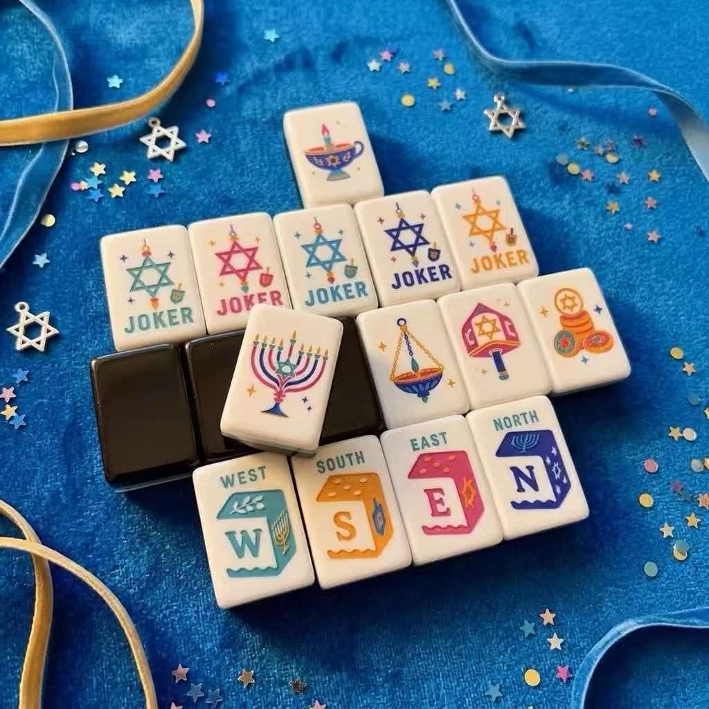 Festival Celebration honors close-up — menorah, hanging lamp, gelt, and compass winds