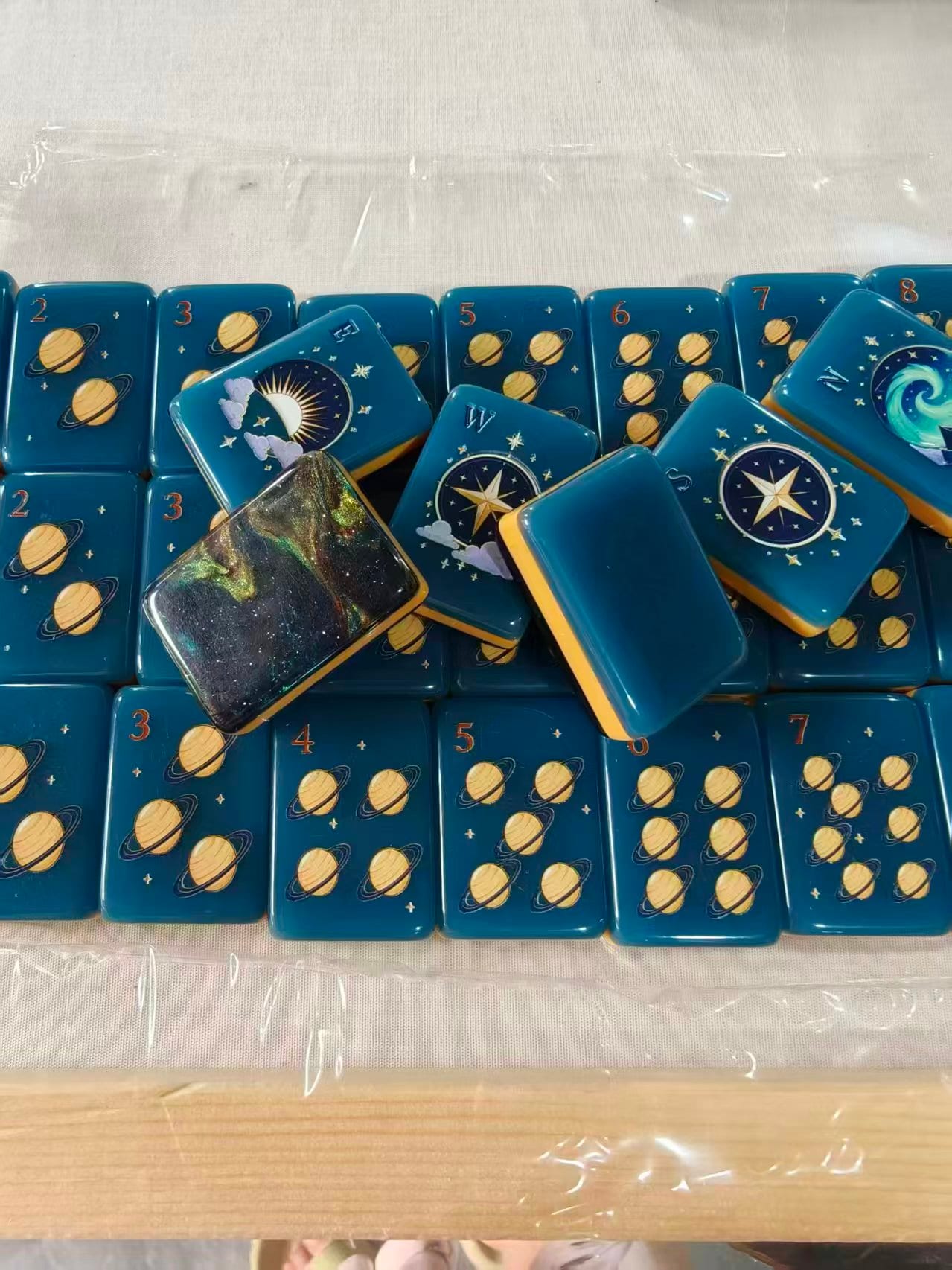 Midnight Galaxy planet suit — Saturn-style dots with rank numerals and a galaxy-pour back