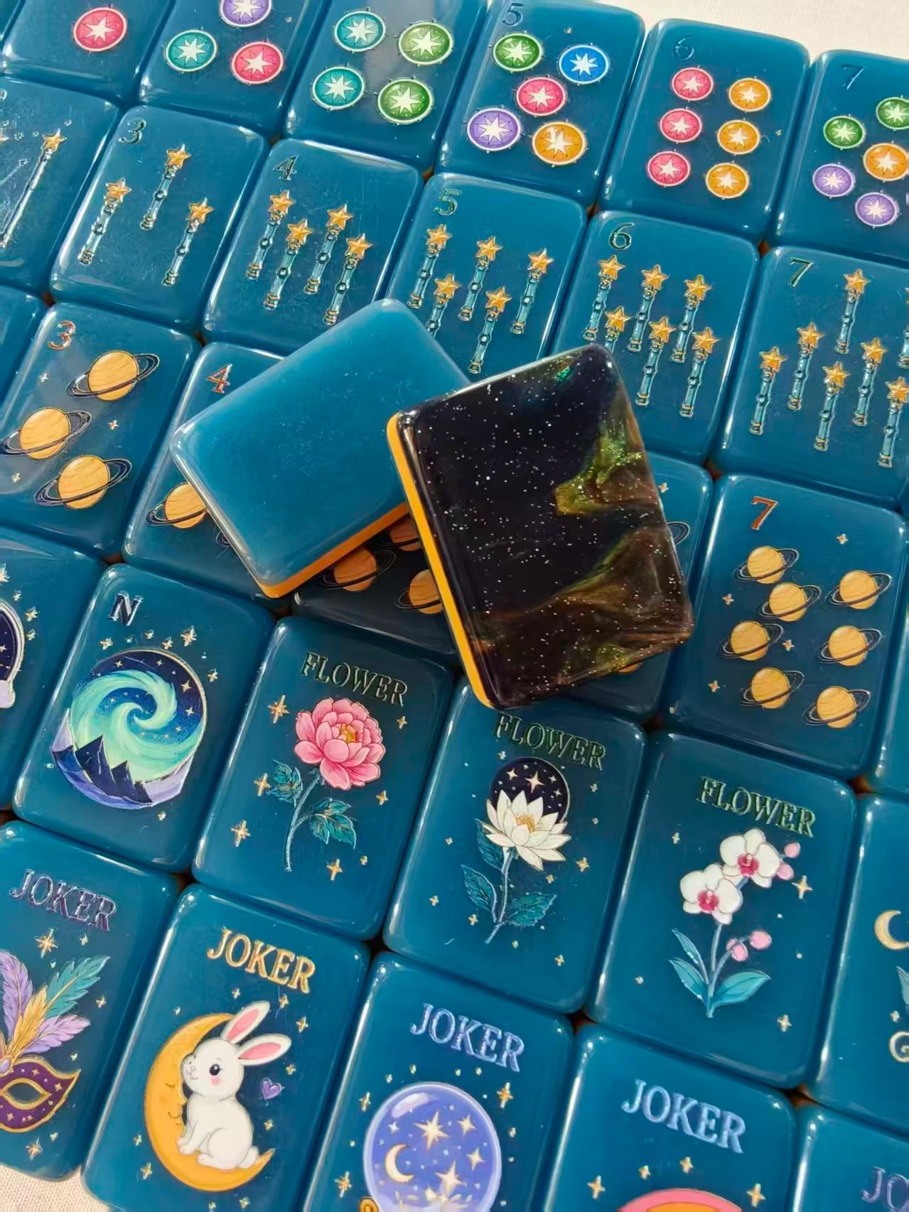 Midnight Galaxy star-wand bams, planet dots, flower tiles, and carnival jokers