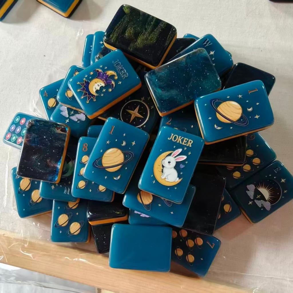 Midnight Galaxy pile — moon-rabbit joker, planet dots, and galaxy backs